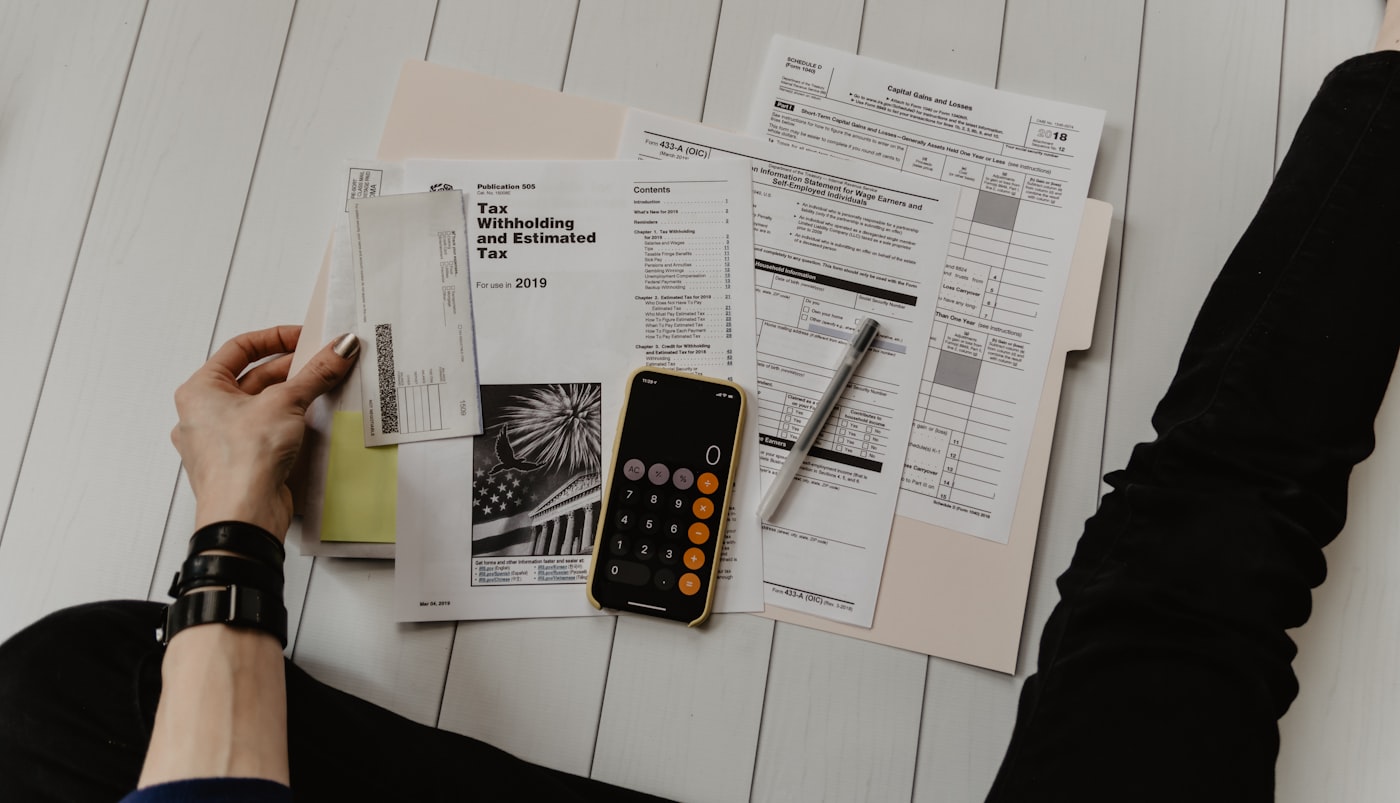 Reviewing financial exposure with documents and a calculator
